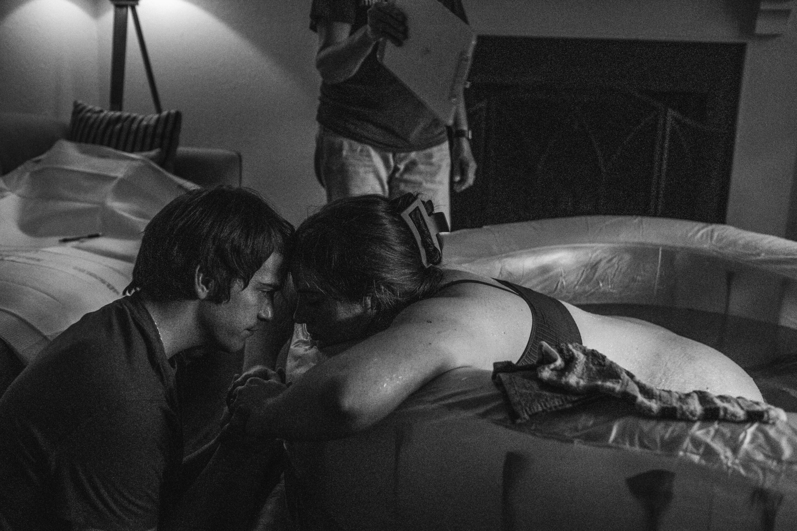 Husband supporting wife during Lawrence Kansas home birth